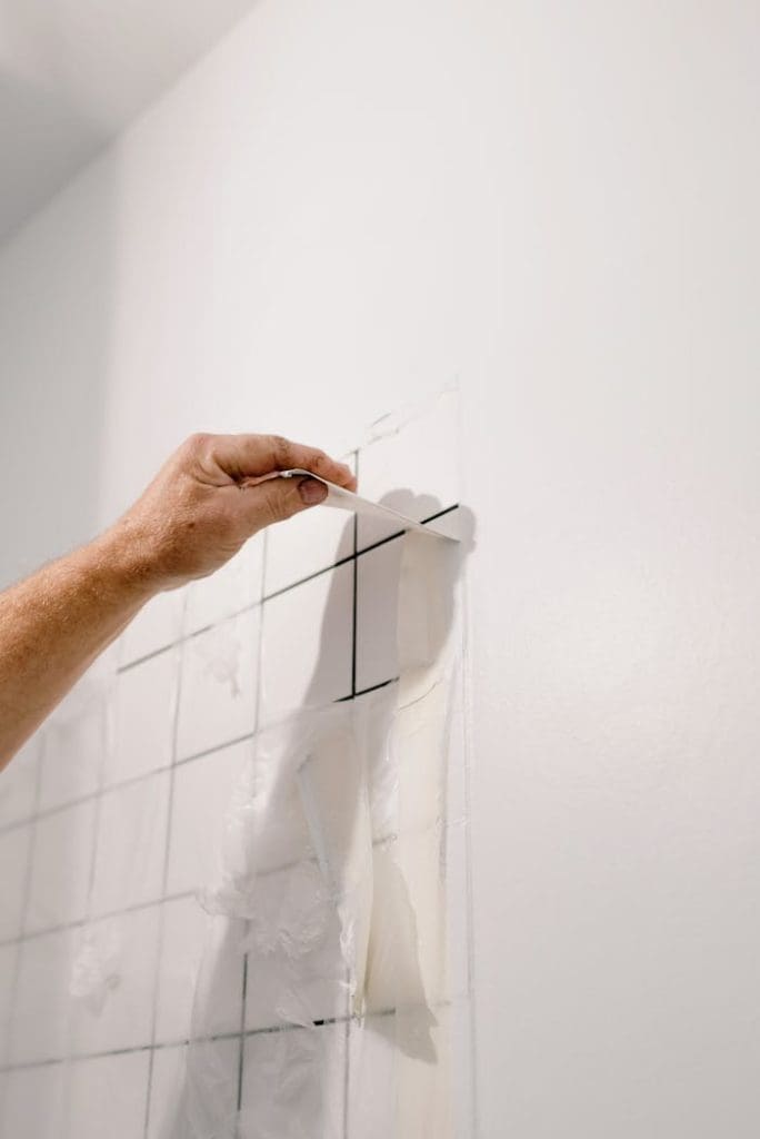 crop-man-repairing-tiled-wall-in-room-5691640 Crop anonymous male doing renovation works in room with tiled walls at home